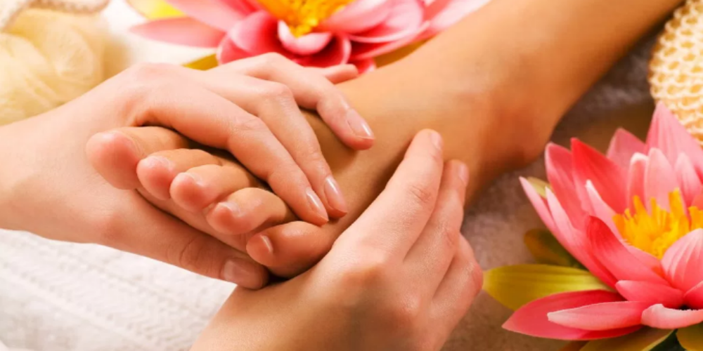 Picture that resembles a woman experiencing Foot Massage by experienced Massage Therapists.
