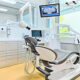 A modern dental office with cutting edge dental equipments and ergonomically designed white and black dental chair.